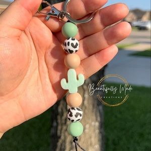 Cow print cactus keychain
